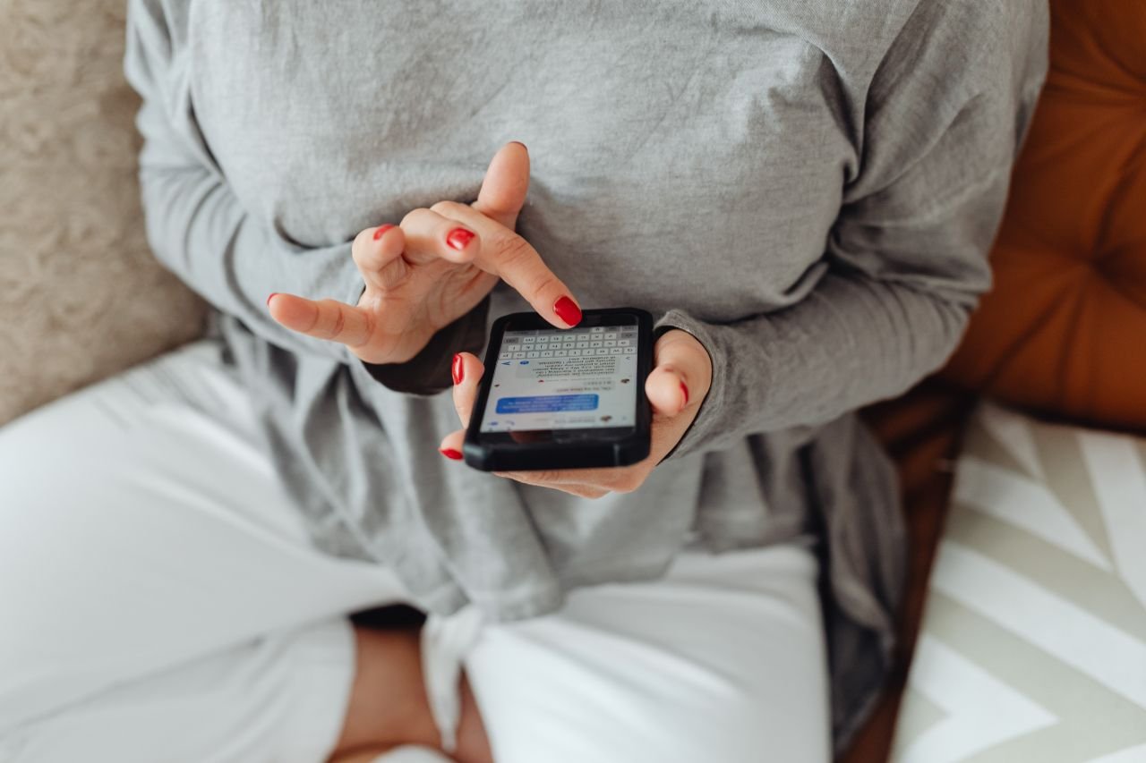 A school administrator using a mobile device